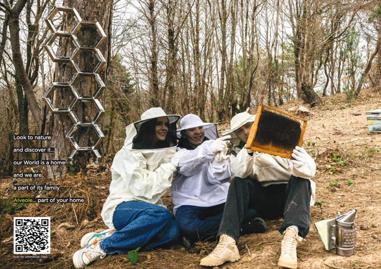 Carisa Alveole Designer Radiator fixed to a tree, photoshoot in the woods with models looking at a honeycomb.