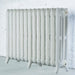 Arroll Montmartre 3 Column Cast Iron Radiator white, next to a white painted brick wall