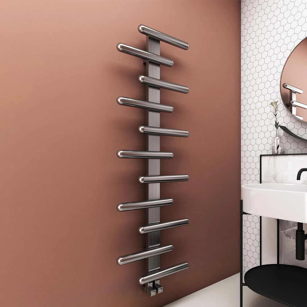Carisa VIVI Stainless Steel Towel Radiator, in a bathroom space fixed to a peach painted wall