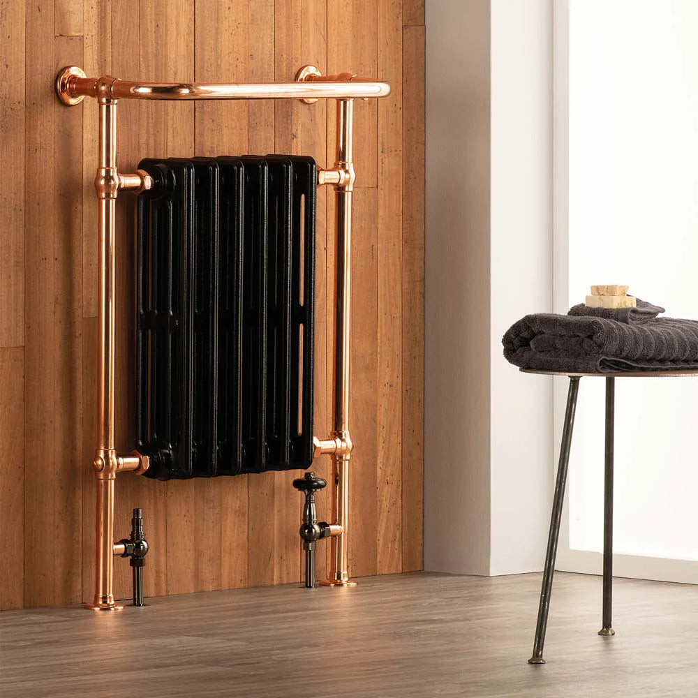 arroll cast iron heated towel radiator painted black with copper rails