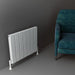 Carisa Angers Double Horizontal Aluminium Radiator white, floor standing in a grey painted room next to a turquoise armchair