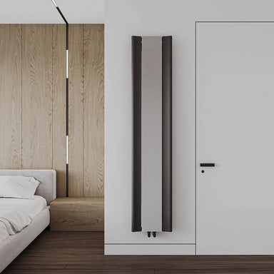 Carisa Burano Mirror Aluminium Radiator, fixed to a white wall in a bedroom