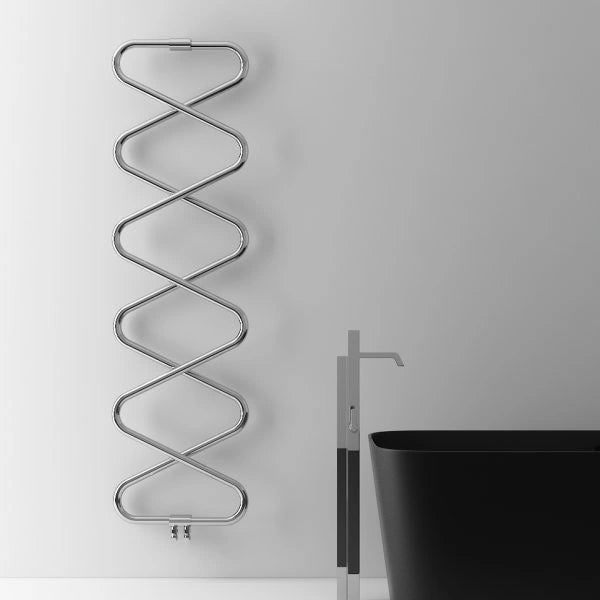 Carisa Ziggy Designer Towel Radiator, fixed to a white painted wall in a bathroom space