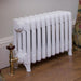 Carron Victorian 4 Column Cast Iron Radiator white, fixed next to a living room wall