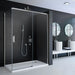 Merlyn 8 Series Frameless Sliding Door in a bathroom space, fixed next to a black tiled wall.