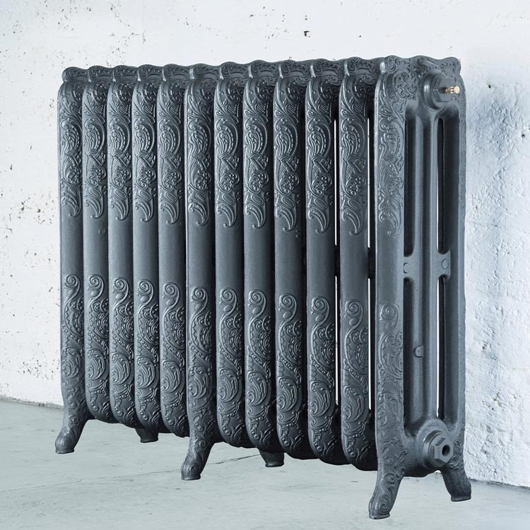 Arroll Montmartre 3 Column Cast Iron Radiator in a living space next to a white painted wall