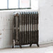 Arroll Montmartre 3 Column Cast Iron Radiator, fixed next to a white painted brick wall