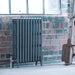 Arroll Neo Classic 3 Column Cast Iron Radiator anthracite, in an industrial living space