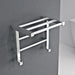 Carisa Etage Towel Radiator, fixed to a grey painted wall in a bathroom space