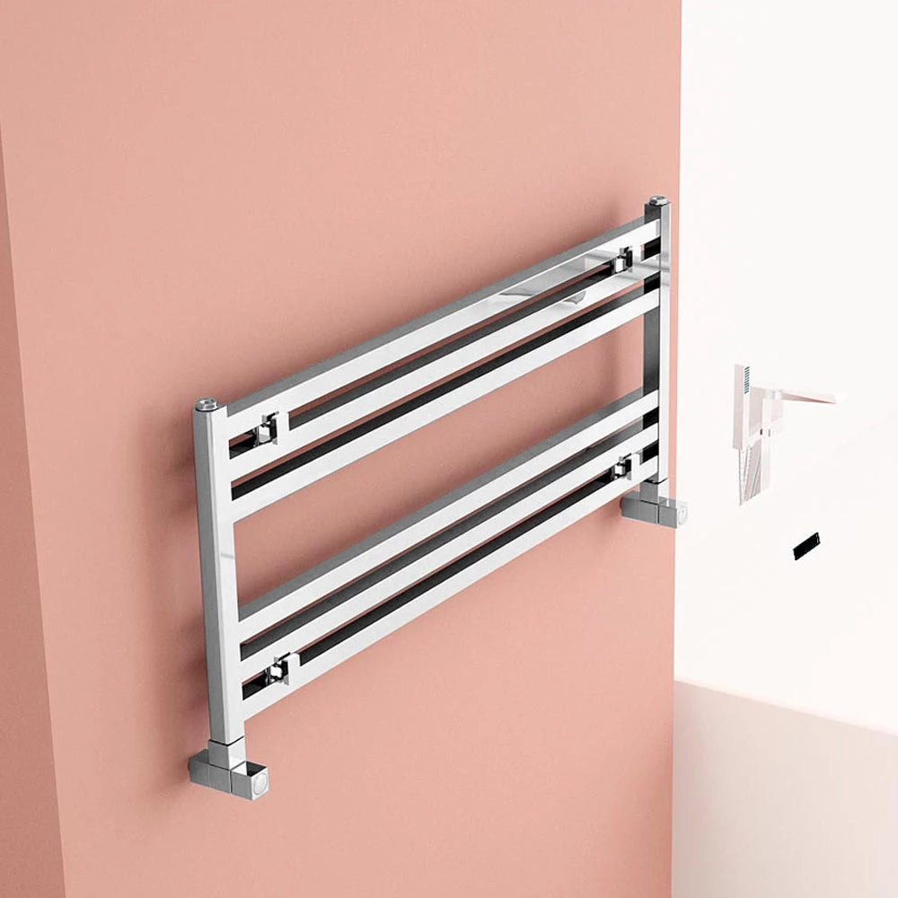 Carisa Fame Horizontal Aluminium Towel Radiator, fixed to a peach painted wall in a bathroom space