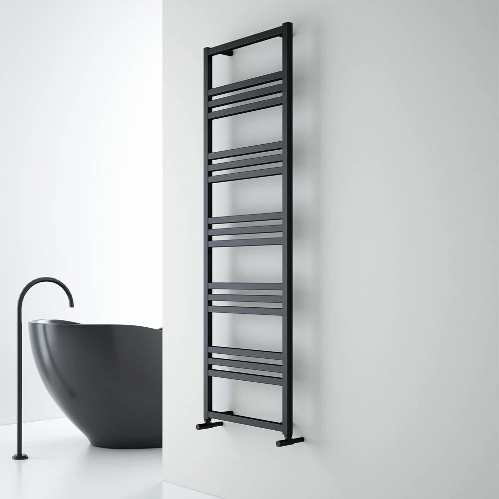 Carisa Frame Aluminium Towel Radiator fixed to a white wall in a bathroom space
