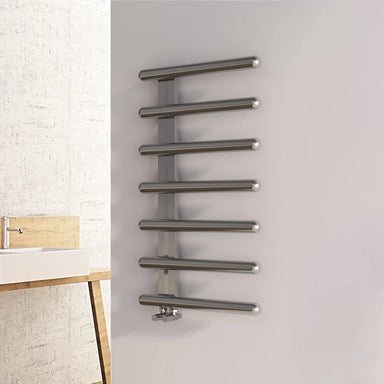 Carisa Ivor Stainless Steel Designer Radiator, fixed to a white painted wall in a bathroom space