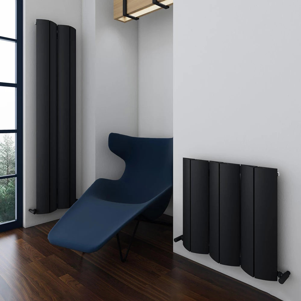 Carisa Nixie Horizontal Aluminium Radiator in a living space, next to the vertical radiator