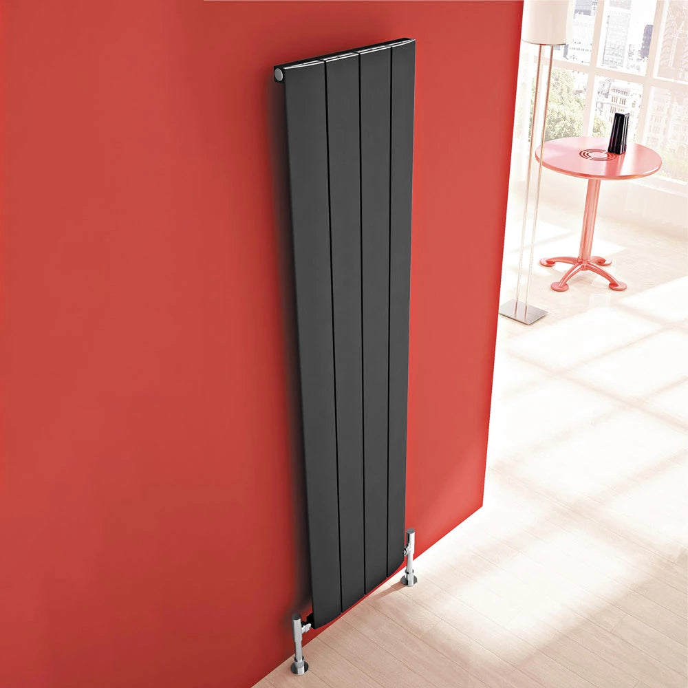 Carisa Slim Vertical Aluminium Radiator in anthracite, fixed to a red painted wall