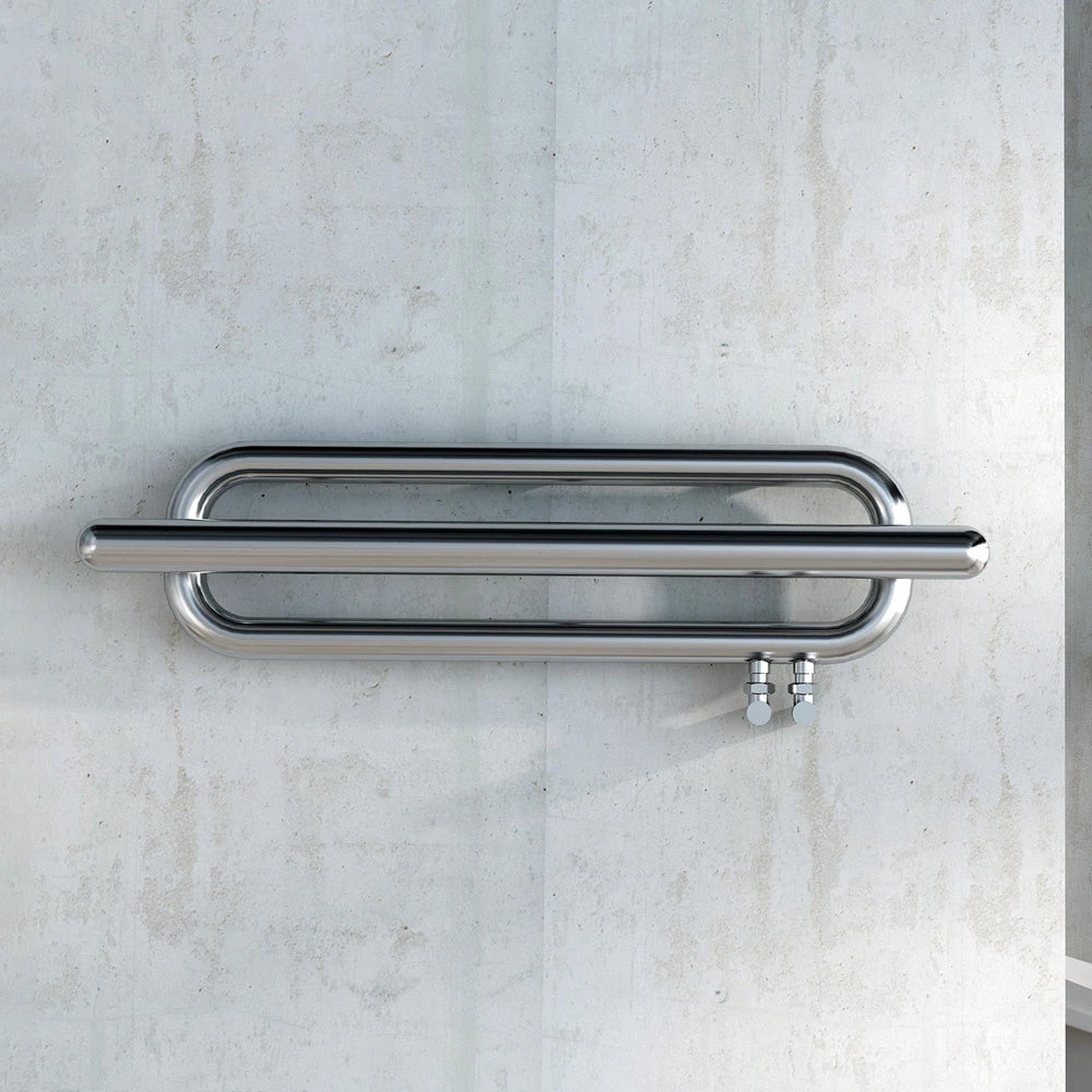 Carisa Swing Stainless Steel Designer Towel Radiator, fixed to a stone wall in a living space
