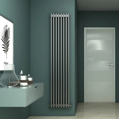 Carisa Versailles Stainless Steel Designer Radiator, in a bathroom space, green painted walls