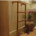 Carron Beckingham Towel Rail within a bathroom attached to the wall with a wooden floor