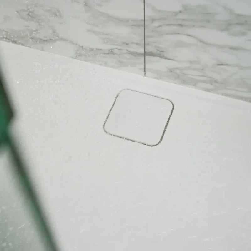 Merlyn MStone Shower Tray, close up of discreet waste