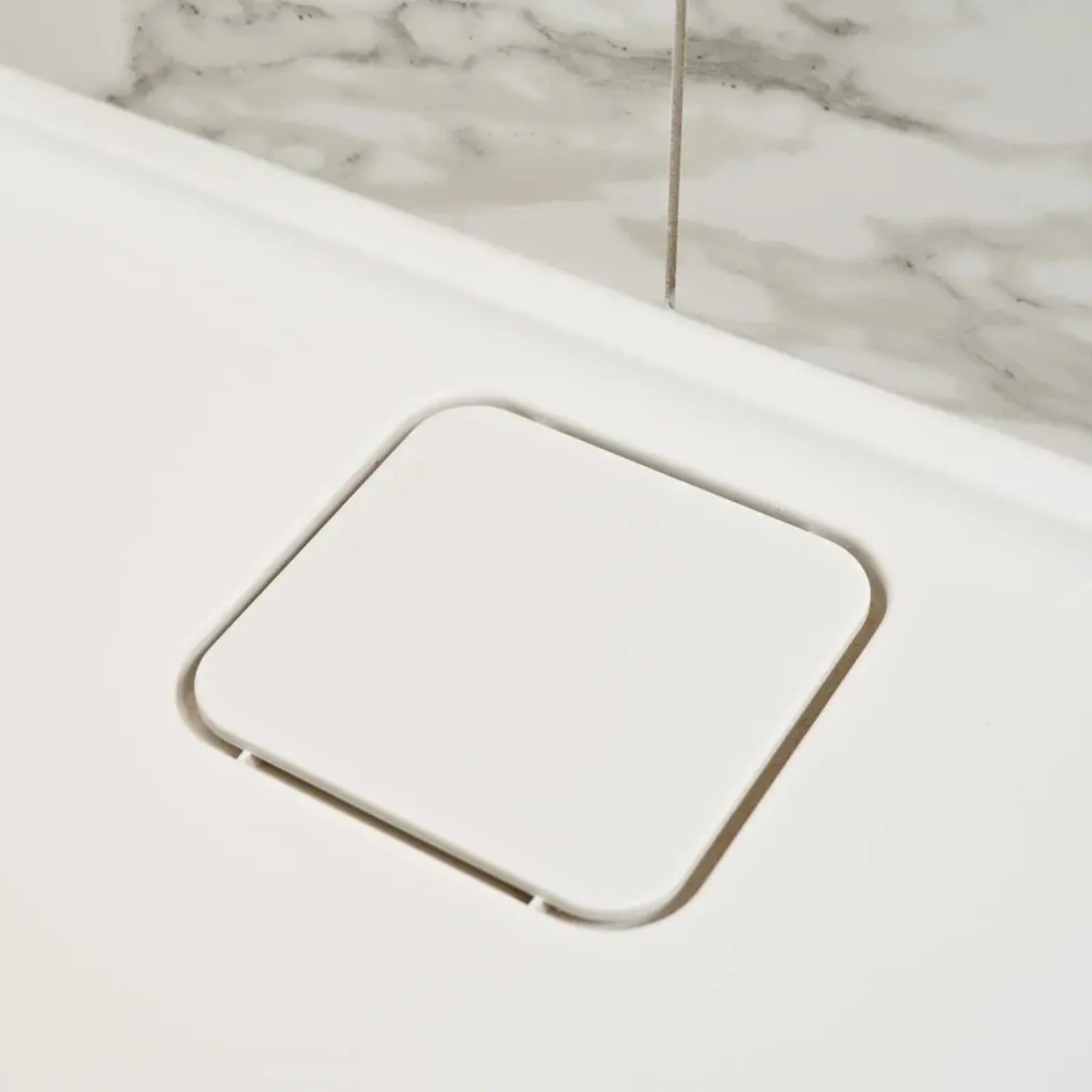 Merlyn MStone Shower Tray discreet waste close up