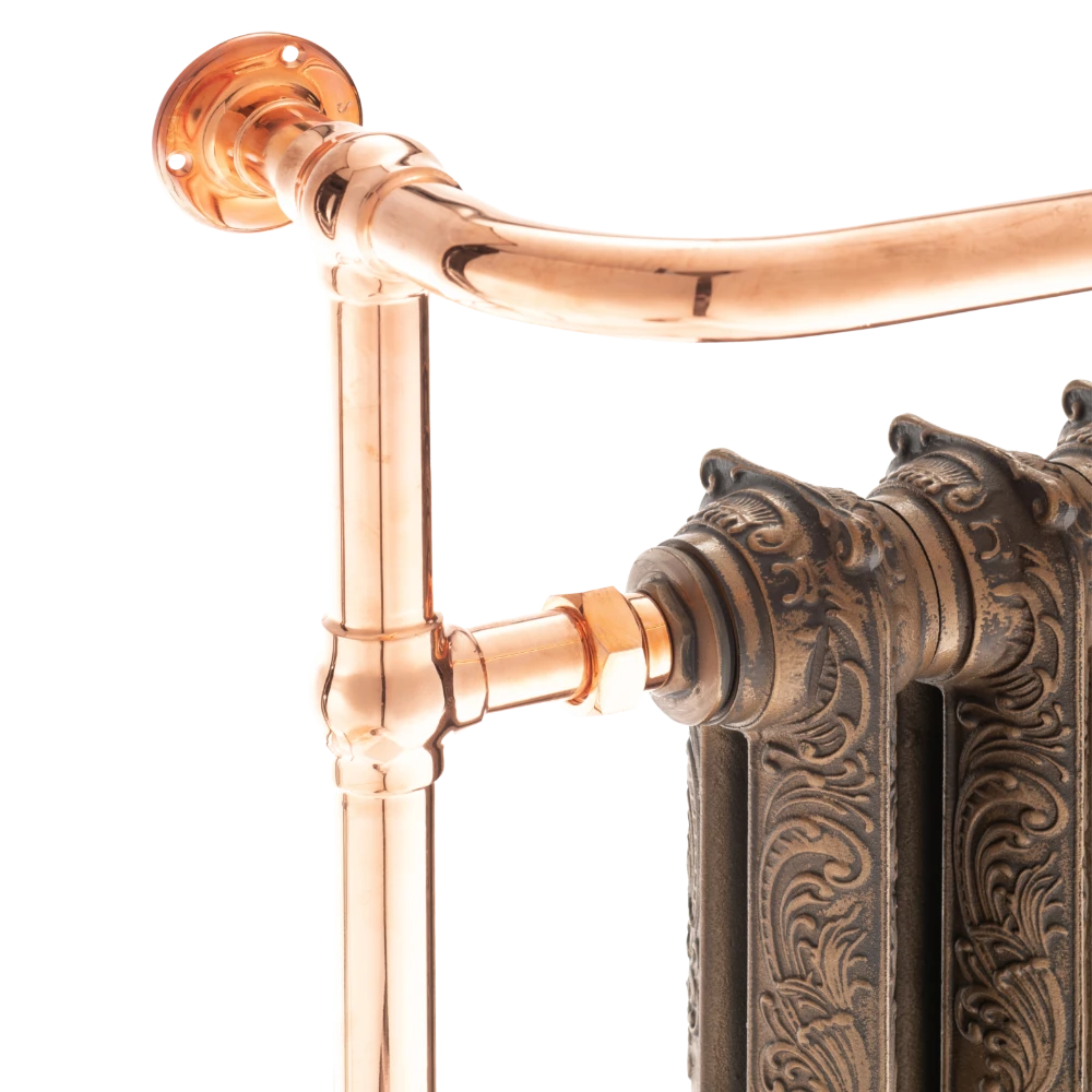 close up image of cast iron towel radiator copper detail 