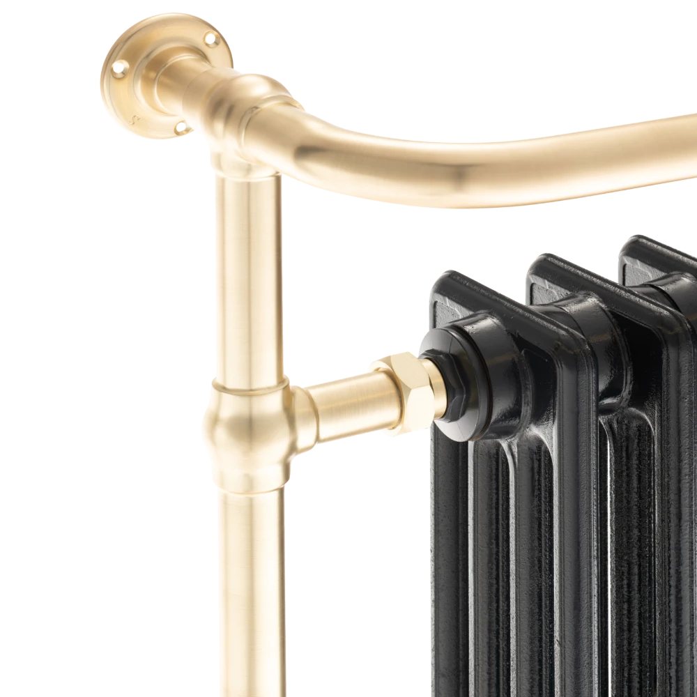 close up image of arroll brushed brass rail painted black radiator detail