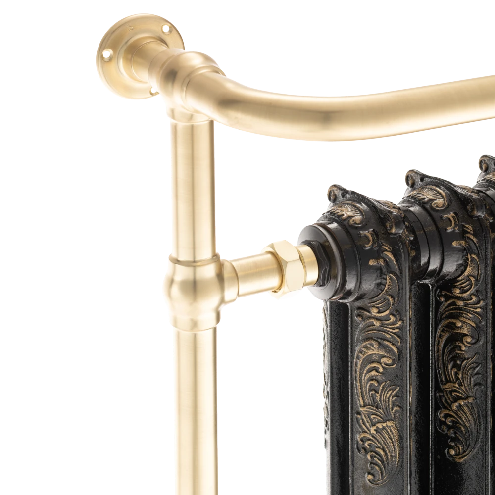 close up image of arroll cast iron brushed brass heated towel radiator