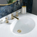 White Mable Basin Top with Polished Gold 3 Tap Hole Basin Mixer and polished gold waste within luxury bathroom