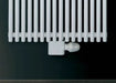 Eucotherm Straight Central Radiator Valve white shown on radiator